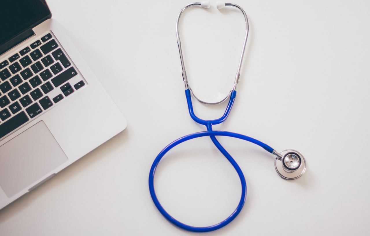 Stethoscope on a laptop representing telemedicine consultations